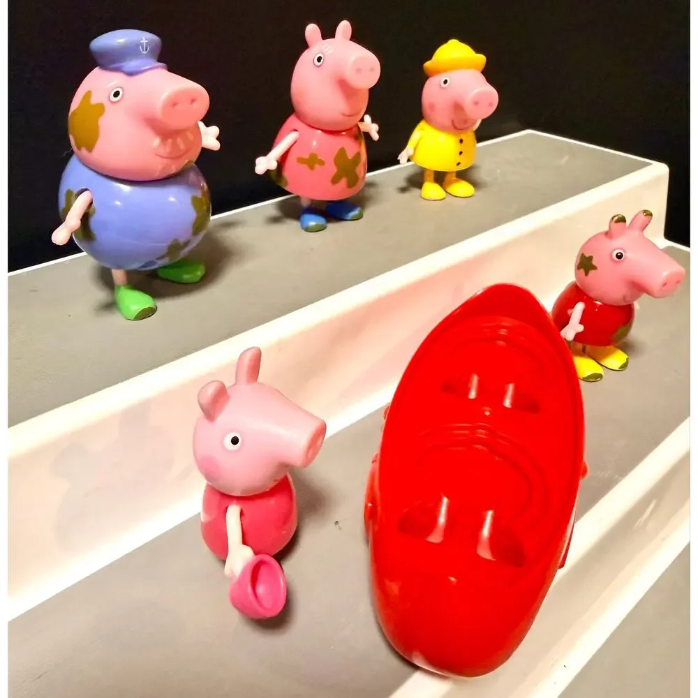 Peppa Pig Muddy Puddles figures and red canoe